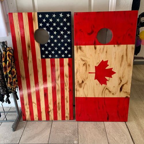 Canadian flag and American flag cornhole boards